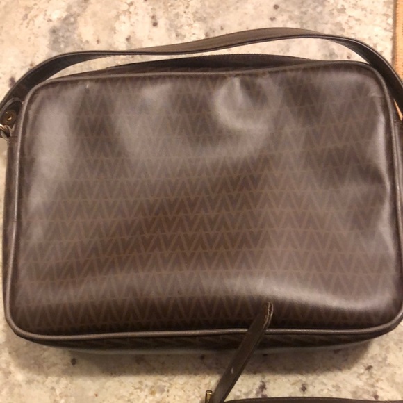 Mario Valentino Crossbody Bag
Mario Valentino
Size: 11 × 8 × 3.5 - Picture 2 of 11